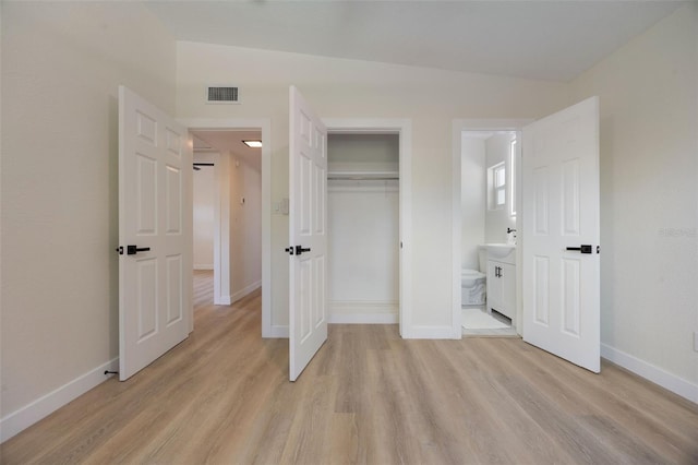 3813 Surrey Dr, Orlando, FL 32812 - unfurnished bedroom with light wood-style flooring, baseboards, and a closet