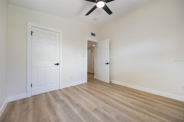 3813 Surrey Dr, Orlando, FL 32812 - unfurnished bedroom featuring light wood-style floors, baseboards, and a ceiling fan