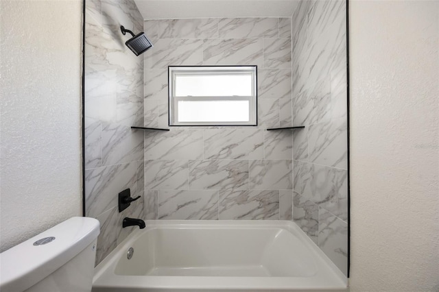 3813 Surrey Dr, Orlando, FL 32812 - bathroom with toilet, a textured wall, and washtub / shower combination
