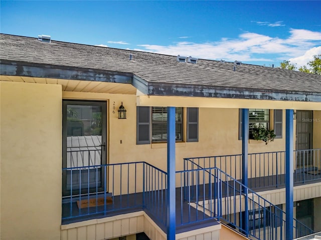 110 N Tremain St Unit 206, Mount Dora, FL 32757 - exterior space with a shingled roof and stucco siding