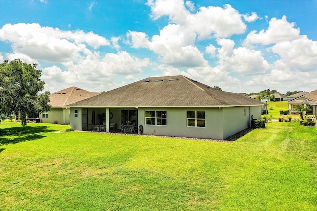 3176 Pearly Dr, Lakeland, FL 33812 - rear view of property featuring a yard, stucco siding, a sunroom, and roof with shingles