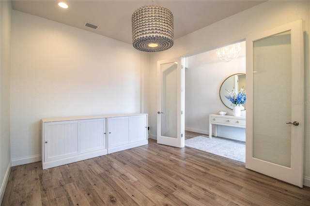 3176 Pearly Dr, Lakeland, FL 33812 - unfurnished dining area featuring wood finished floors, french doors, baseboards, and recessed lighting