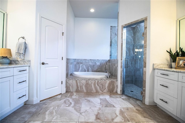 3176 Pearly Dr, Lakeland, FL 33812 - bathroom with vanity, a bath, a stall shower, and marble finish flooring