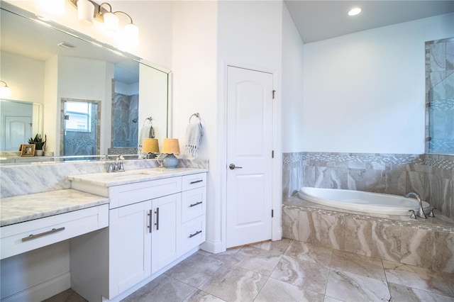 3176 Pearly Dr, Lakeland, FL 33812 - full bathroom with vanity, a garden tub, marble finish flooring, and recessed lighting