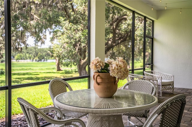 3176 Pearly Dr, Lakeland, FL 33812 - sunroom with a water view and outdoor dining area