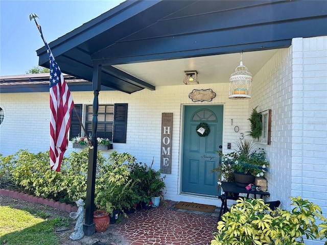103 Inglis Way, Wauchula, FL 33873 - property entrance featuring brick siding and a porch