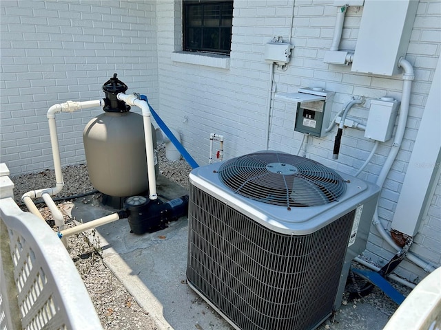 103 Inglis Way, Wauchula, FL 33873 - exterior view of central AC unit, brick siding, and pump
