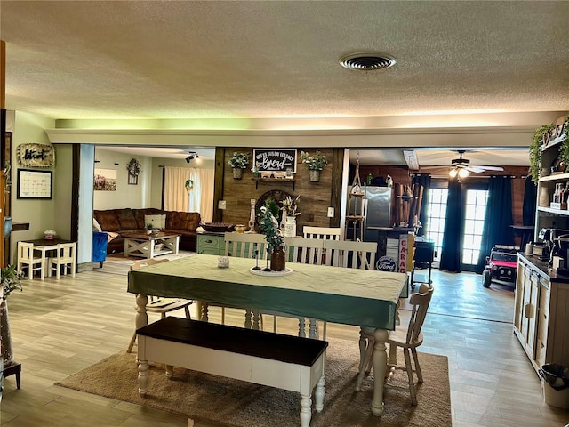 103 Inglis Way, Wauchula, FL 33873 - dining area with a textured ceiling, a ceiling fan, and light wood-style floors