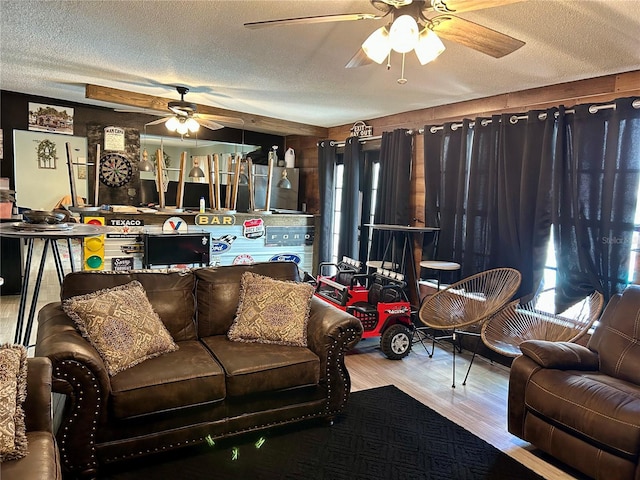 103 Inglis Way, Wauchula, FL 33873 - living room featuring a ceiling fan, a textured ceiling, and wood finished floors