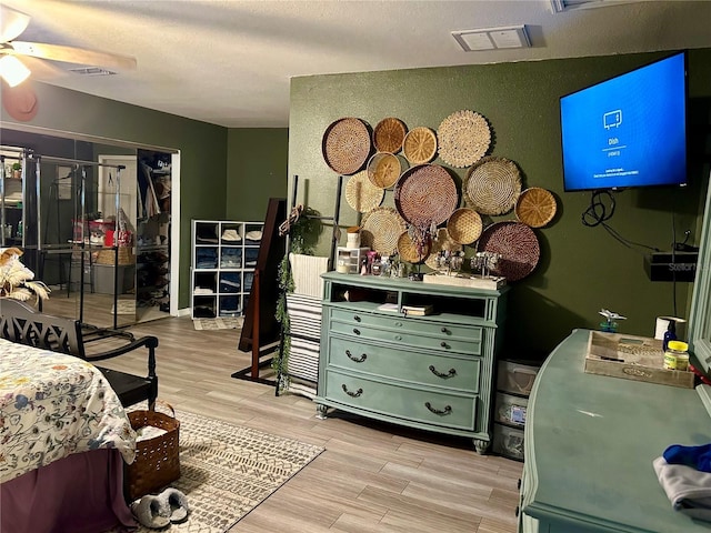 103 Inglis Way, Wauchula, FL 33873 - bedroom with light wood-style flooring and a textured ceiling