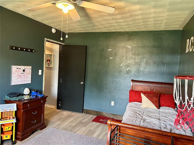 103 Inglis Way, Wauchula, FL 33873 - bedroom with wood finished floors, a ceiling fan, and baseboards