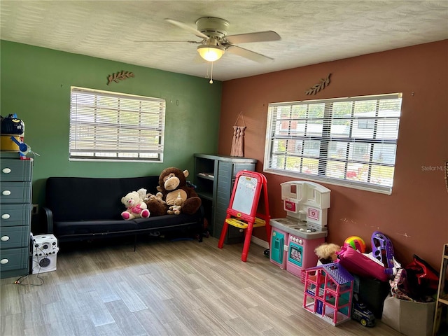 103 Inglis Way, Wauchula, FL 33873 - rec room featuring a ceiling fan, light wood finished floors, and a textured ceiling