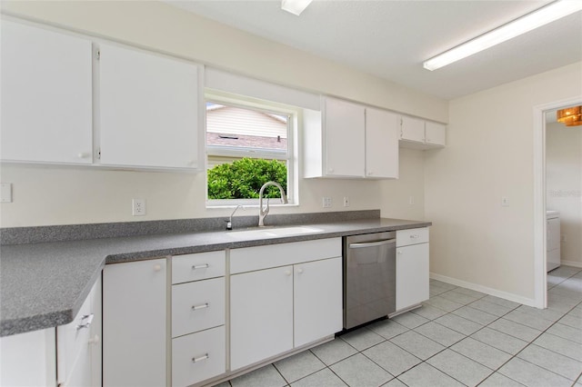 3618 Highland Fairways Blvd, Lakeland, FL 33810 - kitchen with stainless steel dishwasher, a sink, white cabinets, and dark countertops