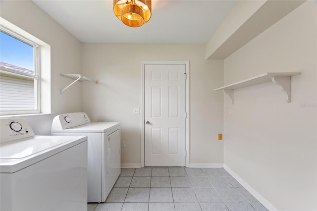 3618 Highland Fairways Blvd, Lakeland, FL 33810 - washroom with separate washer and dryer, light tile patterned floors, and baseboards