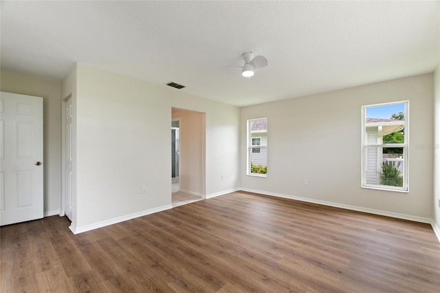 3618 Highland Fairways Blvd, Lakeland, FL 33810 - unfurnished room featuring plenty of natural light, wood finished floors, baseboards, and ceiling fan