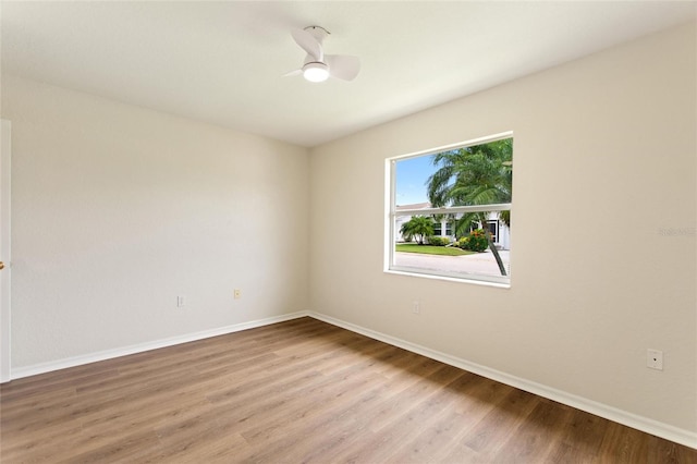 3618 Highland Fairways Blvd, Lakeland, FL 33810 - spare room with wood finished floors, baseboards, and ceiling fan