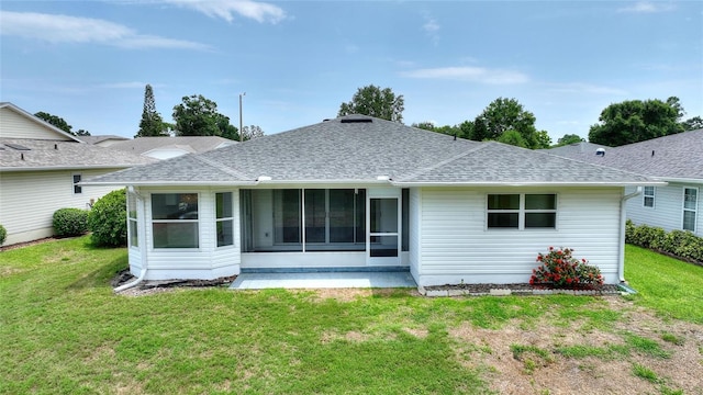 3618 Highland Fairways Blvd, Lakeland, FL 33810 - rear view of property featuring a shingled roof, a yard, and a sunroom