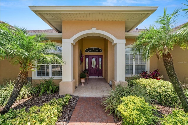 2936 Grasslands Dr, Lakeland, FL 33803 - doorway to property featuring stucco siding
