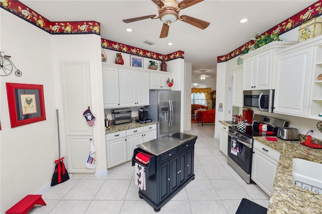 2936 Grasslands Dr, Lakeland, FL 33803 - kitchen with appliances with stainless steel finishes, a ceiling fan, open shelves, white cabinets, and recessed lighting