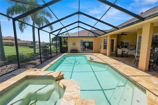 2936 Grasslands Dr, Lakeland, FL 33803 - view of pool featuring a patio area, a lanai, a ceiling fan, and a pool with connected hot tub