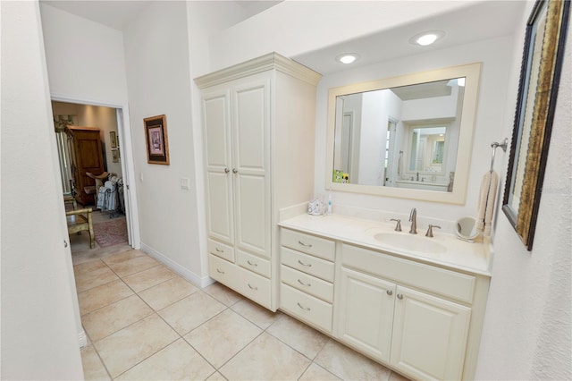 2936 Grasslands Dr, Lakeland, FL 33803 - bathroom with vanity, tile patterned floors, recessed lighting, and baseboards