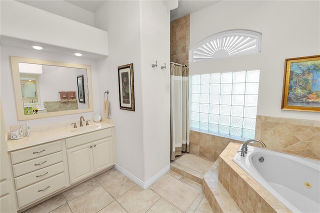 2936 Grasslands Dr, Lakeland, FL 33803 - full bath featuring a whirlpool tub, vanity, tiled shower, and tile patterned floors