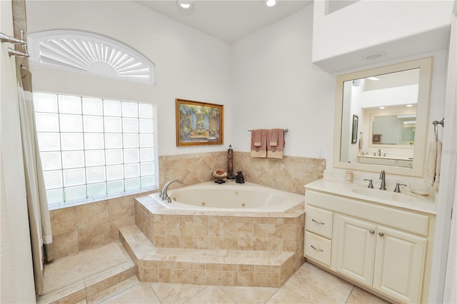 2936 Grasslands Dr, Lakeland, FL 33803 - bathroom with a tub with jets, vanity, tile patterned flooring, and recessed lighting