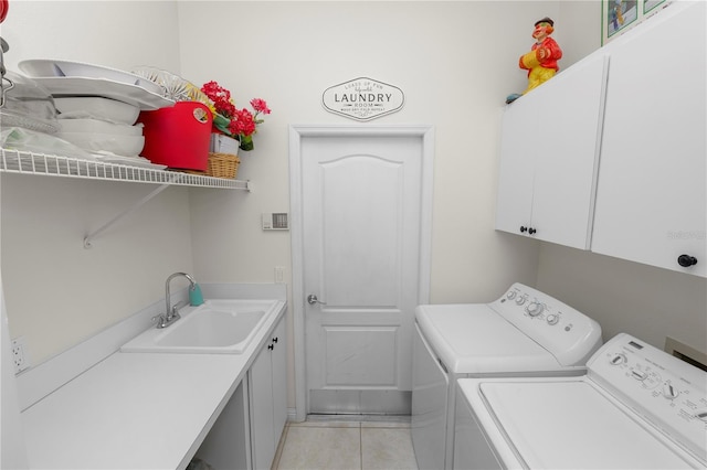 2936 Grasslands Dr, Lakeland, FL 33803 - laundry area featuring cabinet space, washer and dryer, and light tile patterned floors