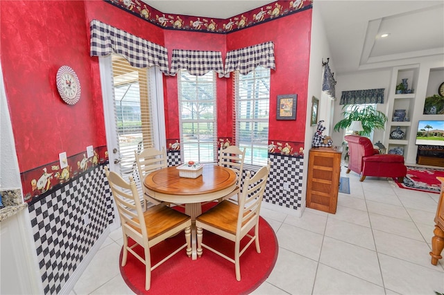 2936 Grasslands Dr, Lakeland, FL 33803 - dining room with healthy amount of natural light, built in shelves, and tile patterned flooring