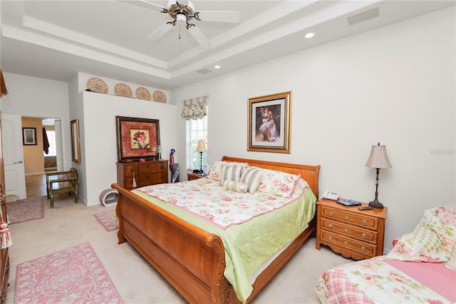 2936 Grasslands Dr, Lakeland, FL 33803 - bedroom featuring light colored carpet, a tray ceiling, recessed lighting, and ceiling fan