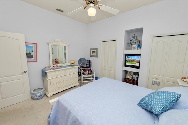 2936 Grasslands Dr, Lakeland, FL 33803 - bedroom featuring multiple closets, light colored carpet, and ceiling fan