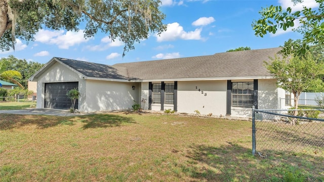 1423 Ridgegreen Loop N, Lakeland, FL 33809 - single story home with an attached garage, stucco siding, and driveway