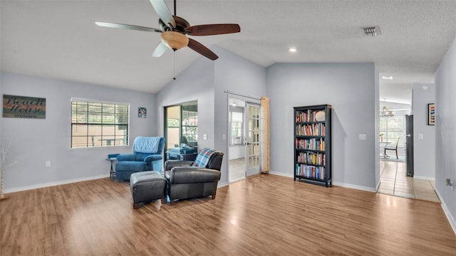 1423 Ridgegreen Loop N, Lakeland, FL 33809 - sitting room featuring a ceiling fan, wood finished floors, baseboards, and lofted ceiling