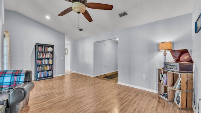 1423 Ridgegreen Loop N, Lakeland, FL 33809 - living area with vaulted ceiling, a ceiling fan, wood finished floors, baseboards, and recessed lighting