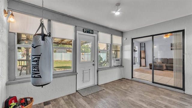 1423 Ridgegreen Loop N, Lakeland, FL 33809 - doorway with wood finished floors, a textured wall, ceiling fan, and cooling unit