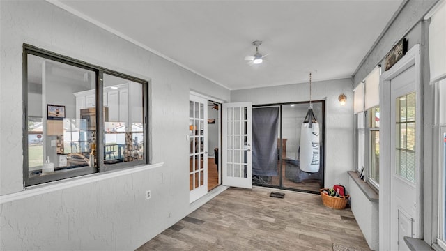 1423 Ridgegreen Loop N, Lakeland, FL 33809 - unfurnished sunroom with french doors, wood finished floors, and ornamental molding