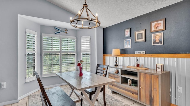 1423 Ridgegreen Loop N, Lakeland, FL 33809 - dining space featuring a chandelier, a textured ceiling, light tile patterned floors, a textured wall, and lofted ceiling