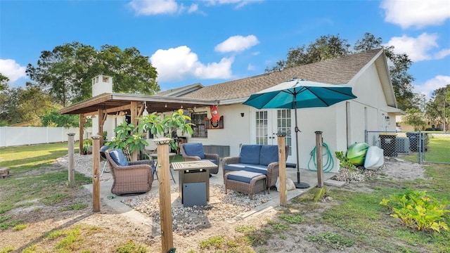1423 Ridgegreen Loop N, Lakeland, FL 33809 - back of house featuring an outdoor hangout area, french doors, a patio, a chimney, and roof with shingles