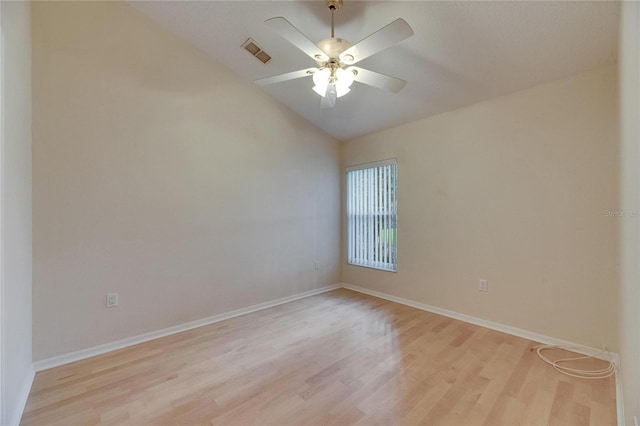 1003 Clearpointe Way, Lakeland, FL 33813 - spare room with light wood-style floors, vaulted ceiling, ceiling fan, and baseboards
