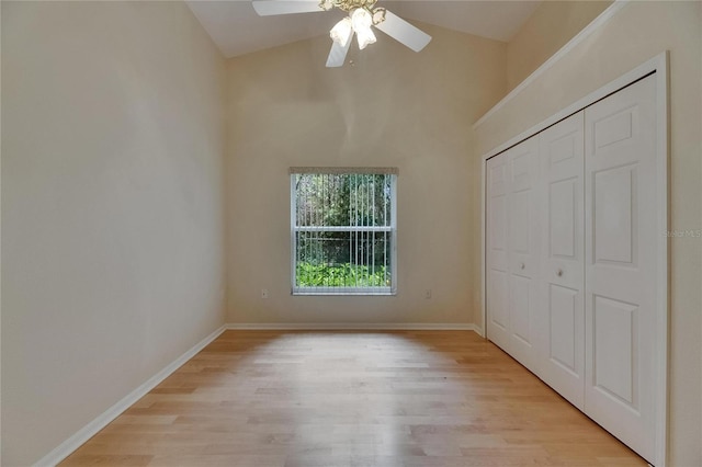 1003 Clearpointe Way, Lakeland, FL 33813 - unfurnished bedroom with light wood-style flooring, a closet, baseboards, ceiling fan, and high vaulted ceiling