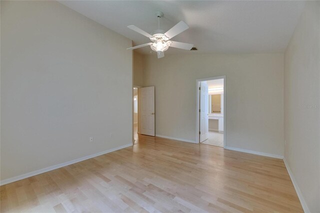 1003 Clearpointe Way, Lakeland, FL 33813 - empty room featuring vaulted ceiling, light wood-type flooring, a ceiling fan, and baseboards