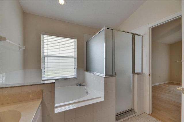 1003 Clearpointe Way, Lakeland, FL 33813 - bathroom with a bath, a shower stall, and vanity