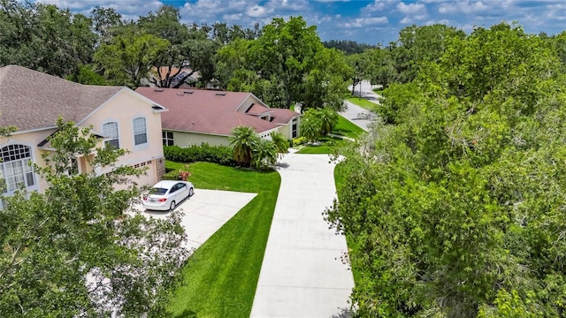 1003 Clearpointe Way, Lakeland, FL 33813 - aerial view of property and surrounding area featuring a tree filled landscape