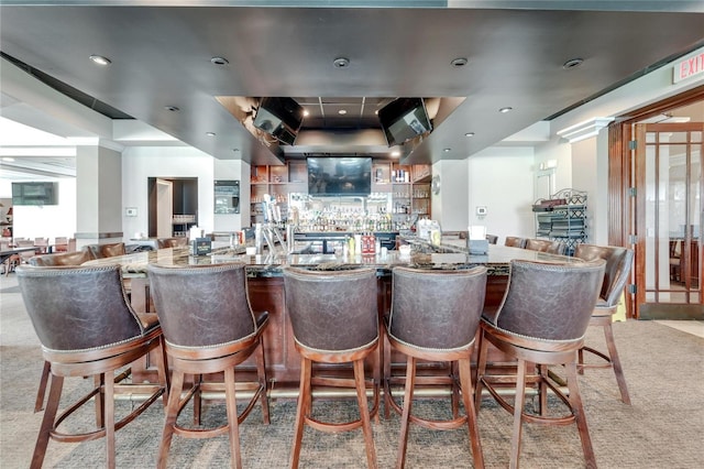 1003 Clearpointe Way, Lakeland, FL 33813 - bar with a raised ceiling, light colored carpet, and recessed lighting