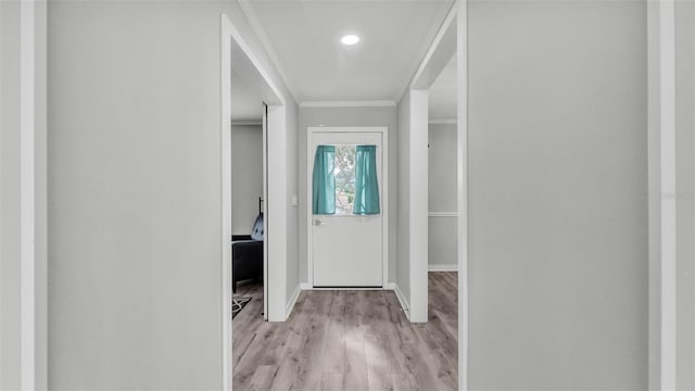 4825 Foxrun, Lakeland, FL 33813 - entrance foyer featuring ornamental molding, light wood-style flooring, and baseboards