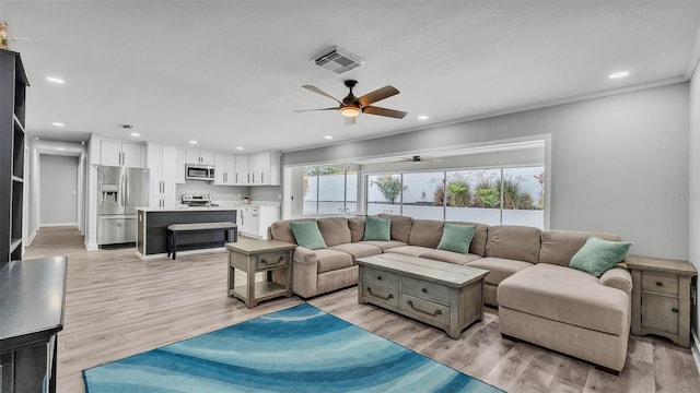 4825 Foxrun, Lakeland, FL 33813 - living area with ceiling fan, light wood-type flooring, and recessed lighting