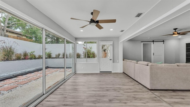 4825 Foxrun, Lakeland, FL 33813 - sunroom / solarium featuring a barn door