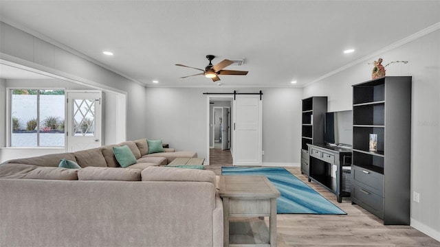 4825 Foxrun, Lakeland, FL 33813 - living area with ornamental molding, a barn door, light wood-type flooring, a ceiling fan, and recessed lighting