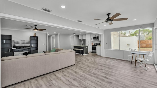 4825 Foxrun, Lakeland, FL 33813 - living room with a ceiling fan, light wood-type flooring, and recessed lighting