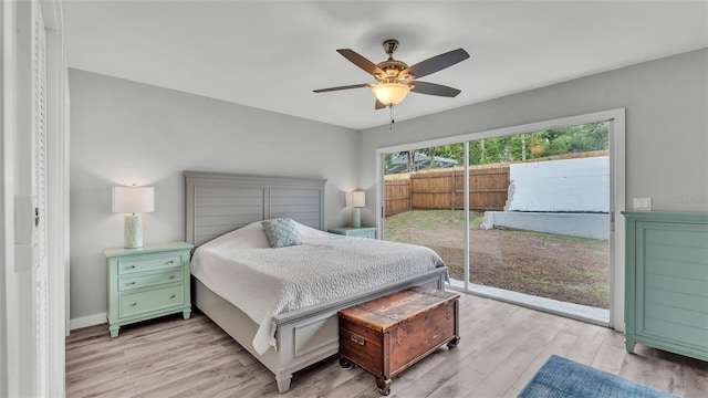 4825 Foxrun, Lakeland, FL 33813 - bedroom featuring access to exterior, light wood-type flooring, and ceiling fan
